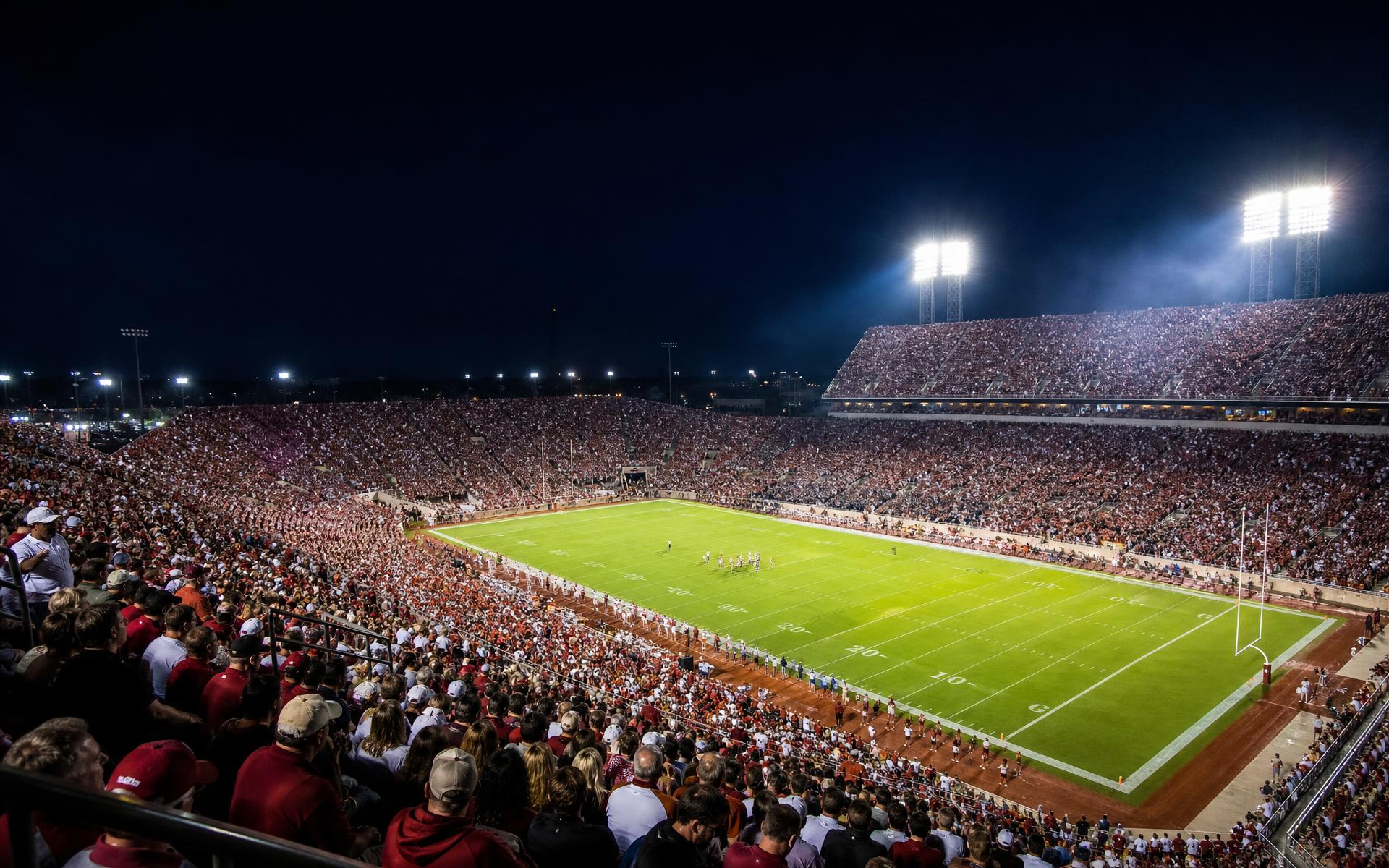 Packed night-lit football stadium in Texas glowing under floodlights